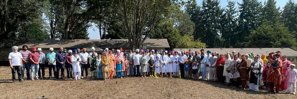 The Olympia Gurdwara community gathered outdoors